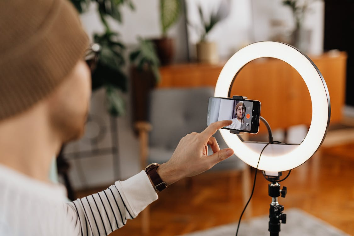 A person recording a video on a phone