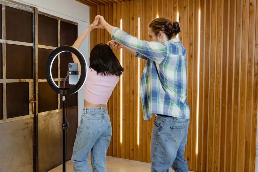 A couple dancing and recording a video