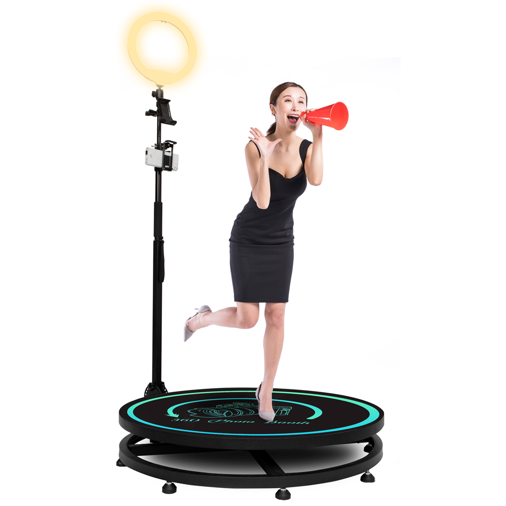 a woman using a 360 photo booth