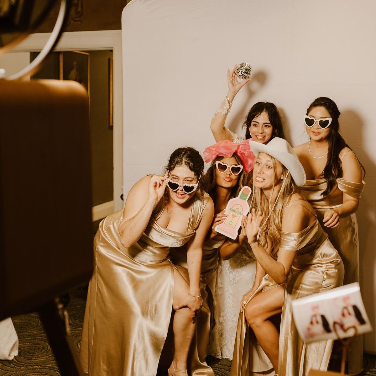 Guests posing together for a photo booth print