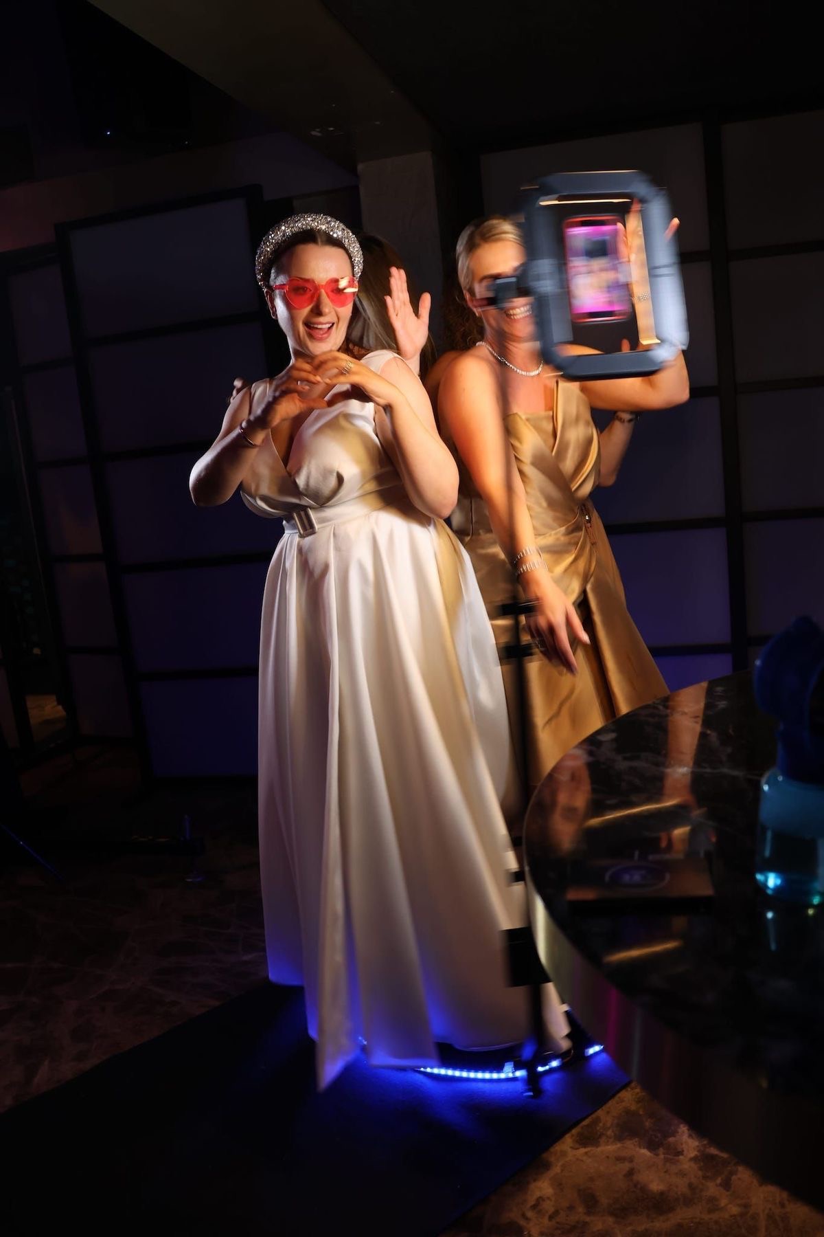 Guests enjoying a 360 degree video booth experience at an event